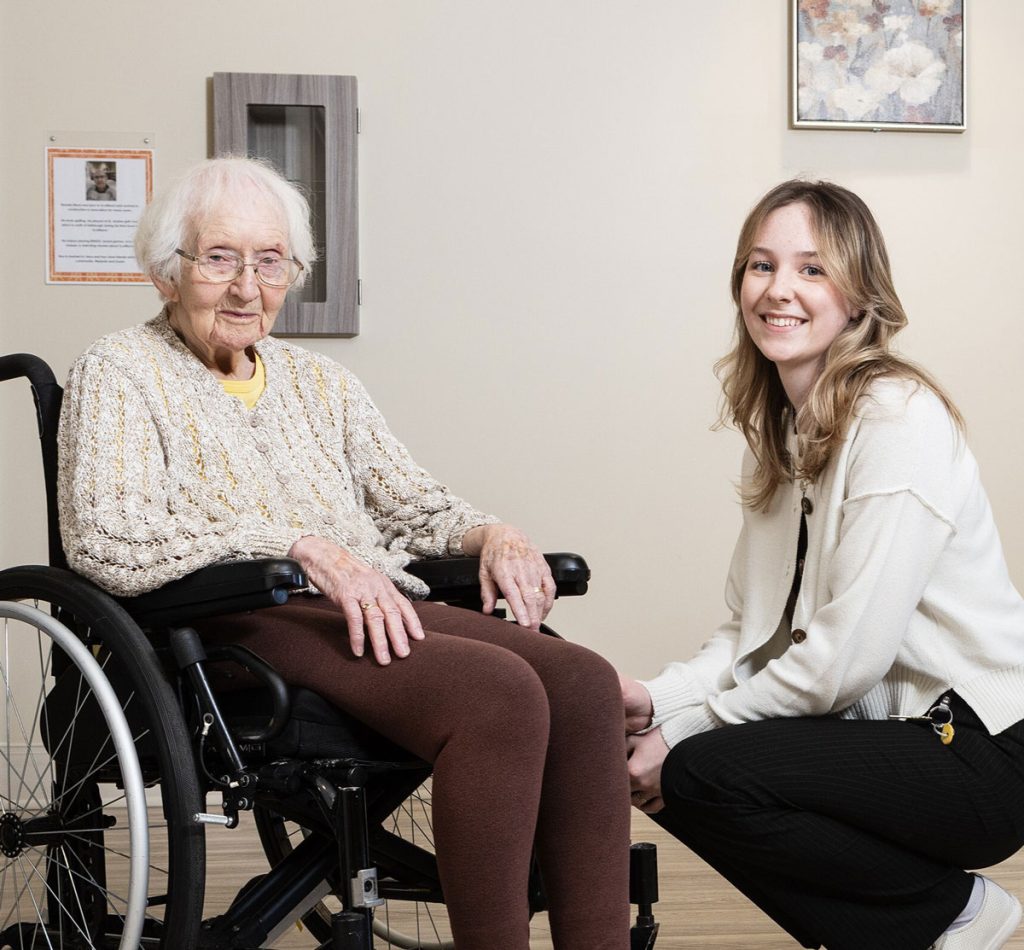 smiling team member with resident